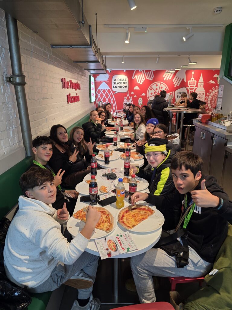 People enjoying premium vegan pizza in a stylish Soho restaurant